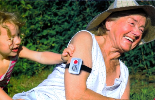 Woman with SOS Pendant strapped to her arm