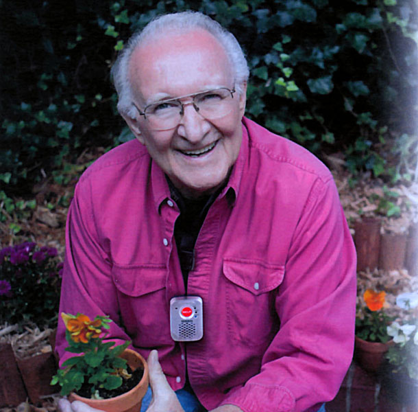 Man with ADAPTED SOS Pendant on lanyard around the neck